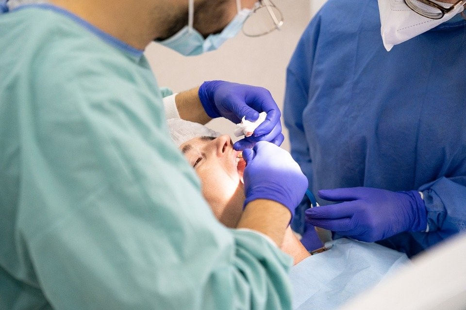 A dentist offering dental treatment to the patient