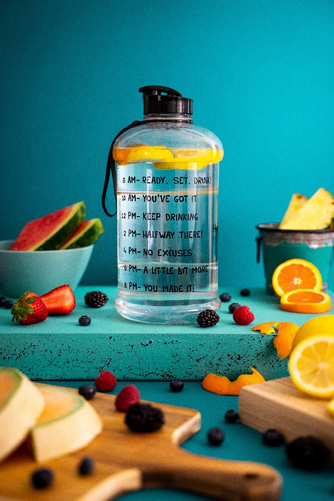 assorted fruits near water bottle