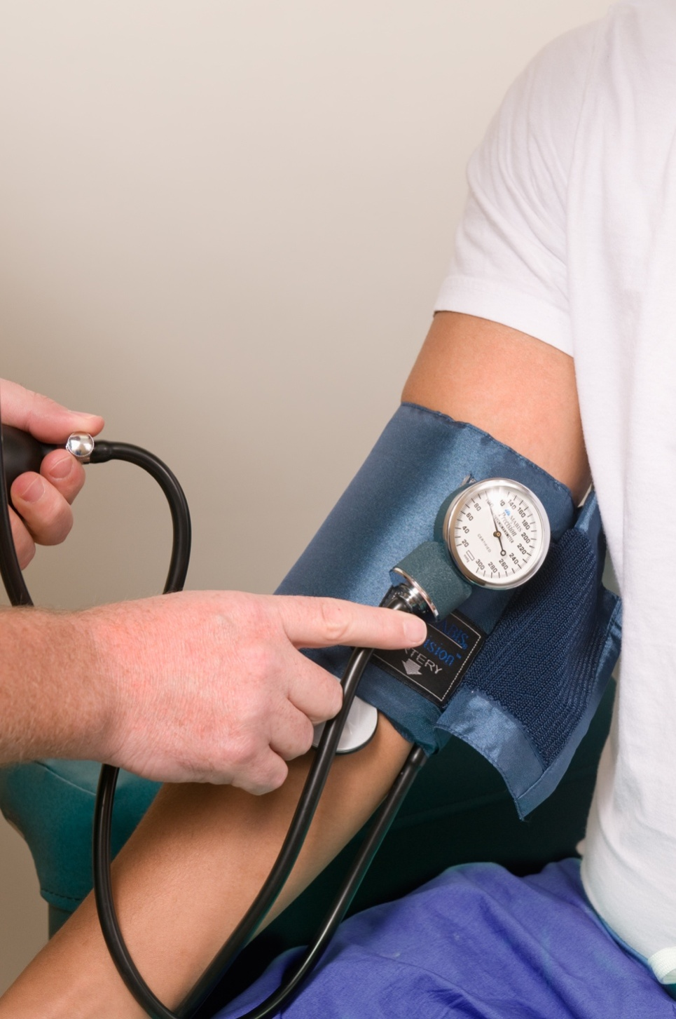 Doctor checking a patient's blood pressure