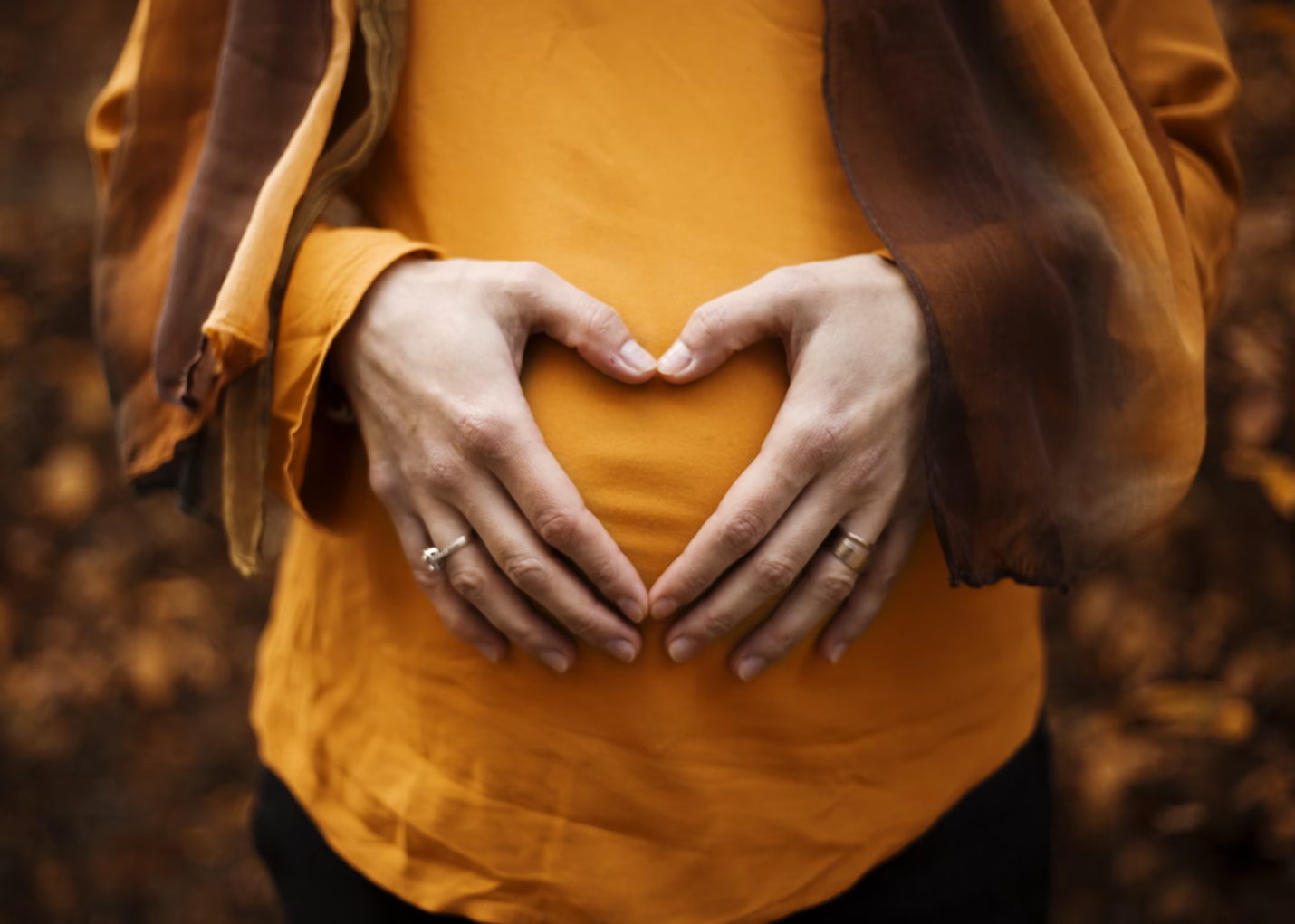 A photo showing a person holding their stomach