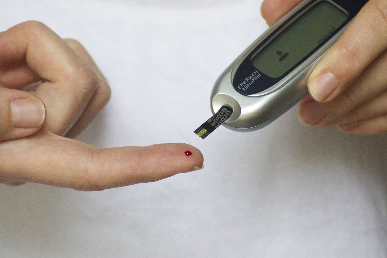 A person checking blood sugar