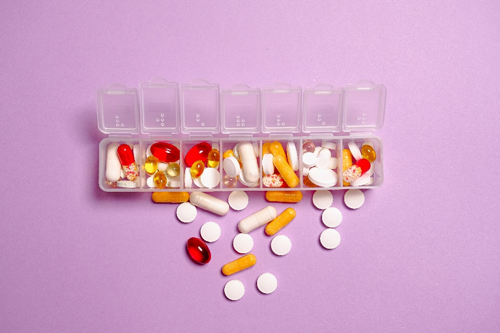 Pills spilling out of a container