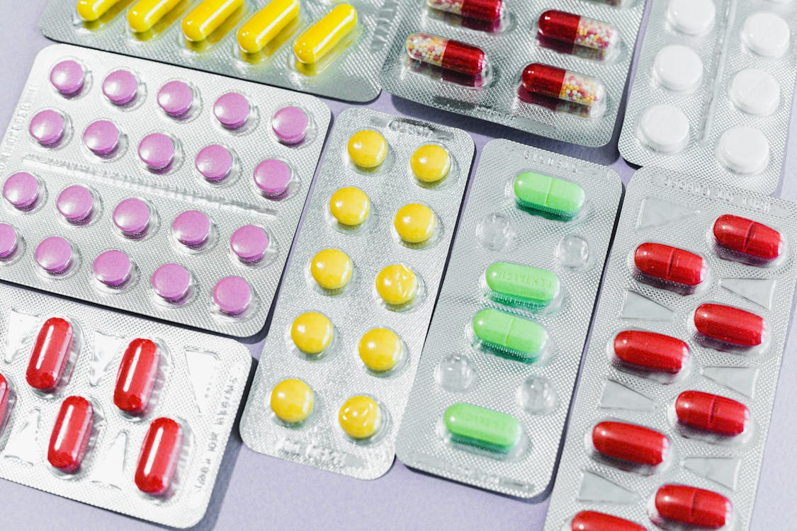 Assorted colorful prescription pills in blister packaging